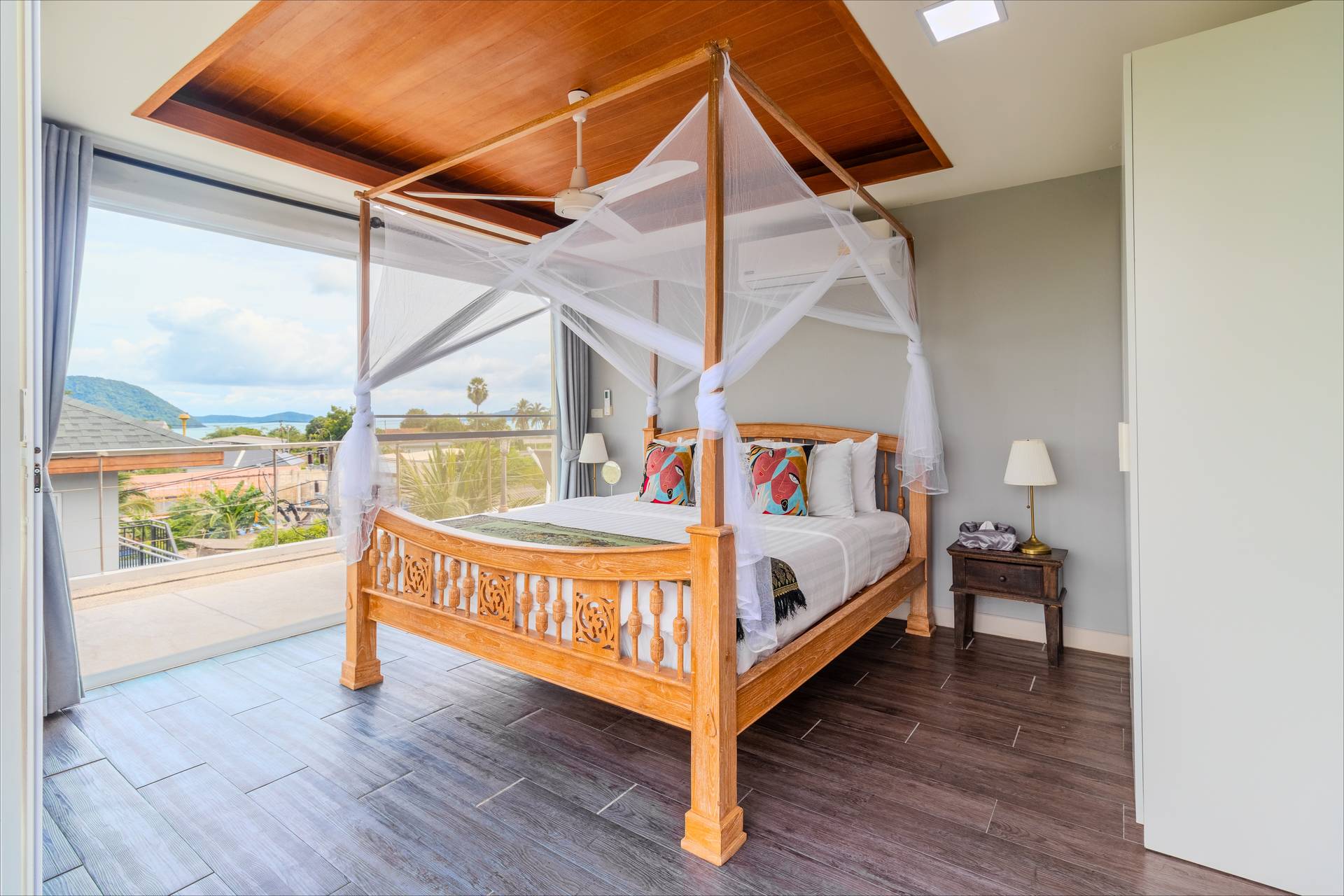 Spacious master bedroom with king-size bed, premium linens, and modern decor at the Phuket villa