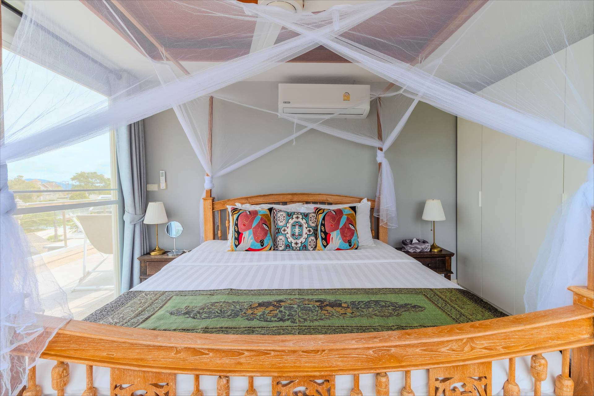 Romantic four-poster canopy bed with mosquito net and panoramic mountain views