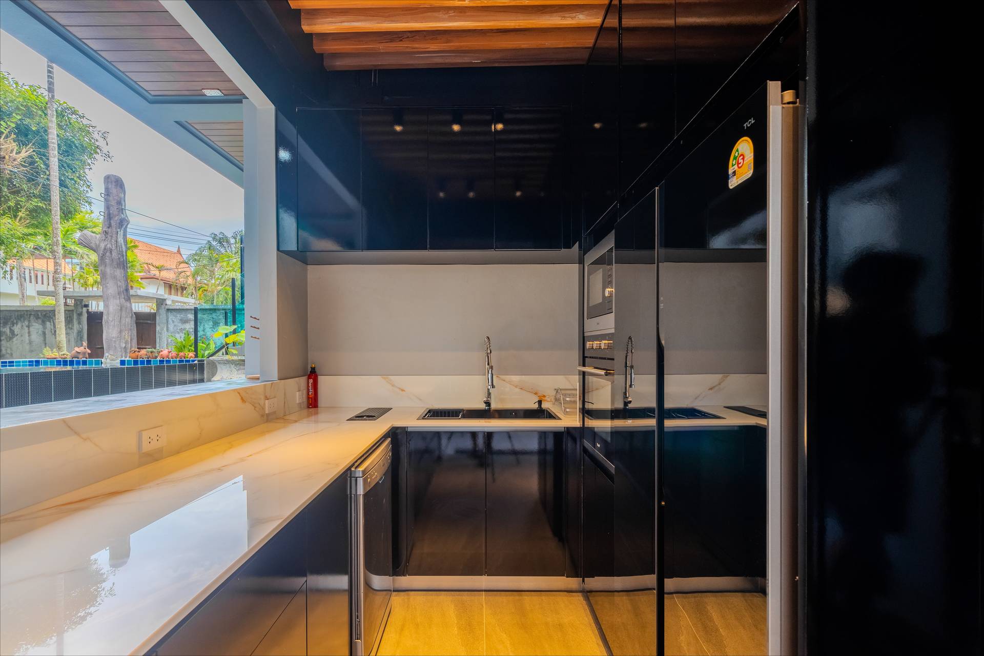 Dining area adjacent to the kitchen with seating for twenty guests